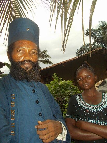 Father Theophile with a young woman of the parish